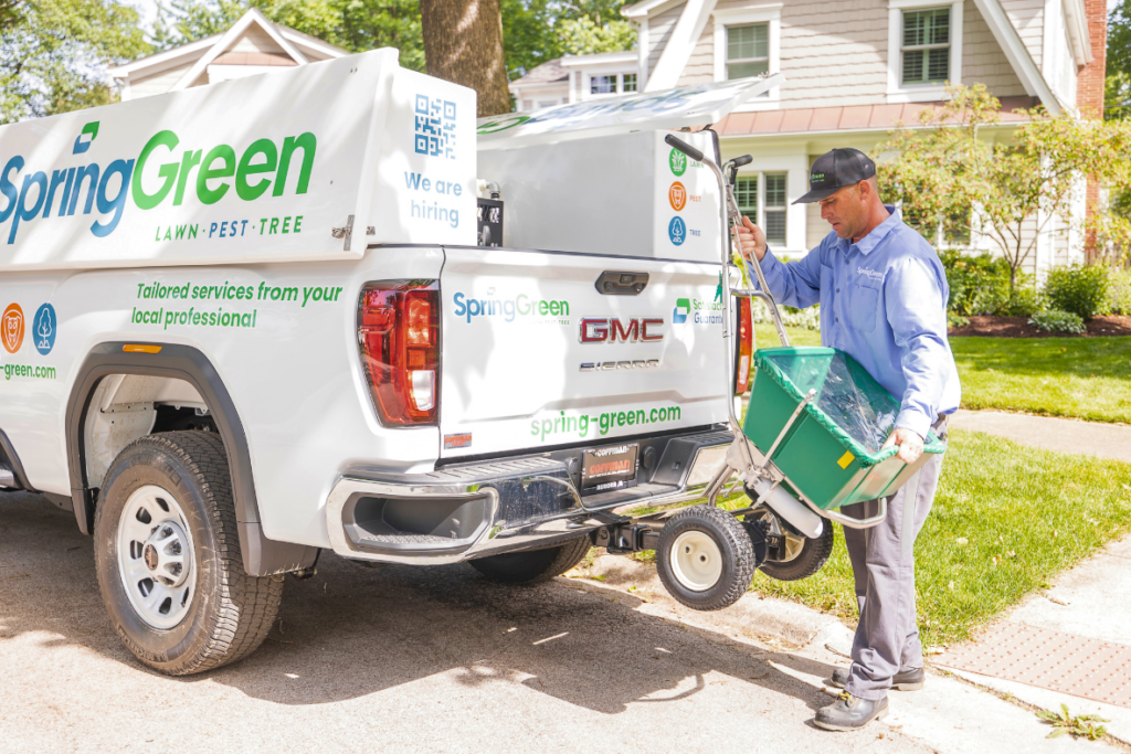 springgreen lawncare professional unloading supplies from springgreen branded truck