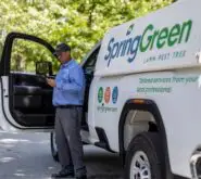 SpringGreen employee stepping out of SpringGreen truck
