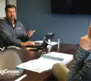 SpringGreen business consultant sitting with client in conference room