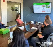 SpringGreen team in conference room, doing discovery day process with new franchisees