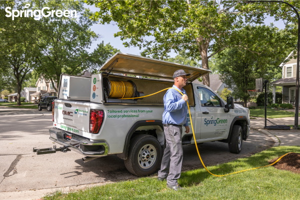 SpringGreen employee working outside doing pest control
