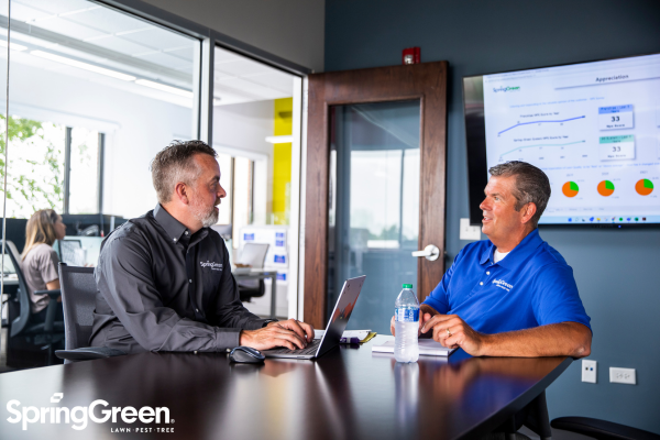 SpringGreen consultant talking to client in conference room