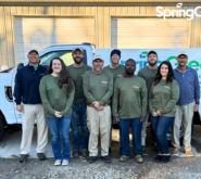 SpringGreen team standing infront of SpringGreen truck