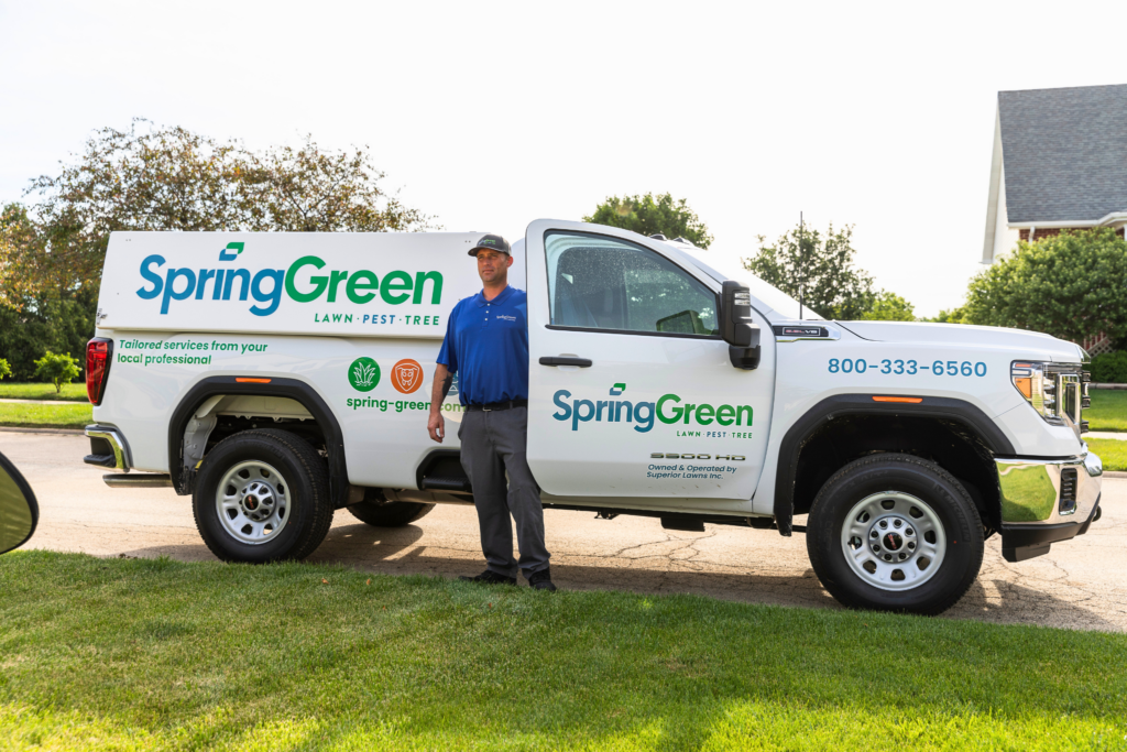 SpringGreen employee getting of SpringGreen truck