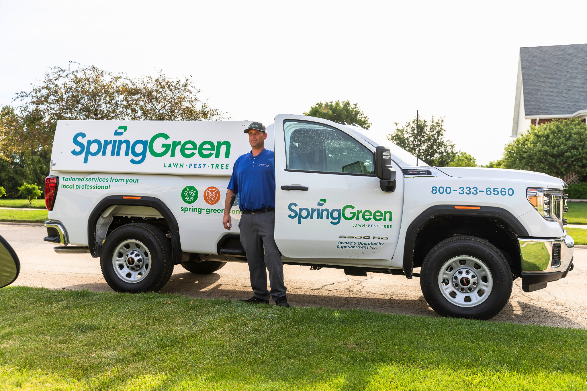 SpringGreen employee getting of SpringGreen truck