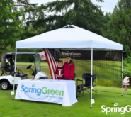 SpringGreen doing local marketing at a golf course with a SpringGreen branded tent set up
