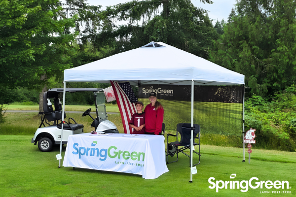 SpringGreen doing local marketing at a golf course with a SpringGreen branded tent set up