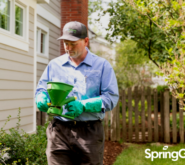 SpringGreen employee doing pest control outside of customers house