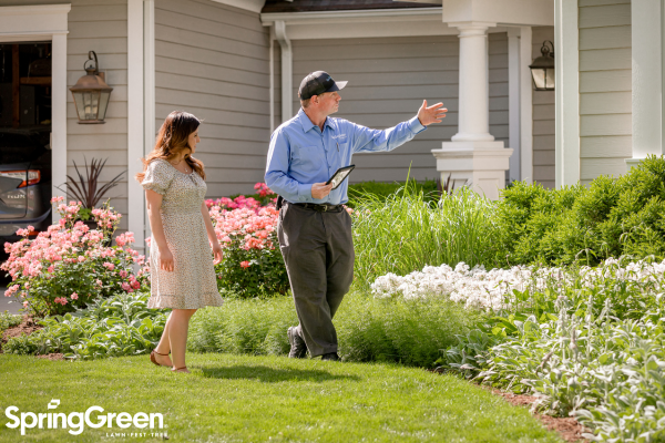 SpringGreen employee talking to customer outside
